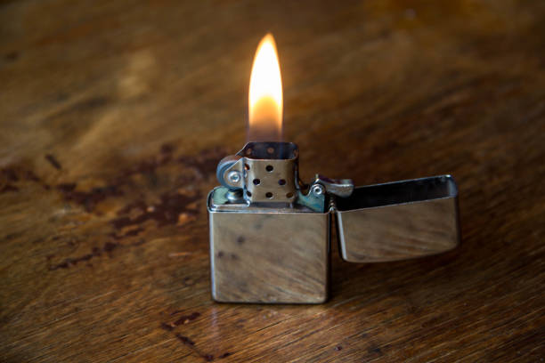 istock gasoline lighter on a wooden background 1127986563