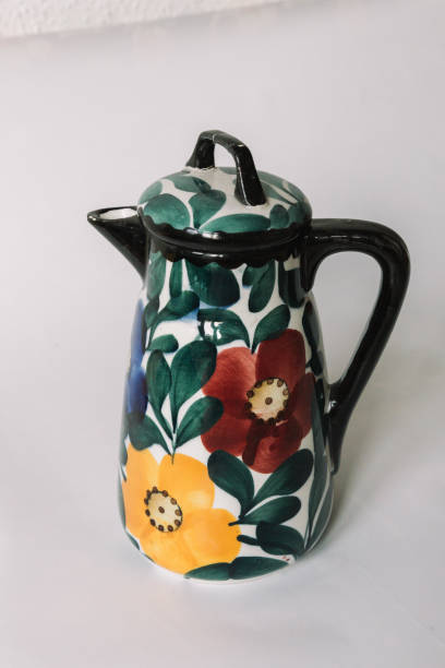 istock a white teapot  with floral and line pattern on white background 1127989977