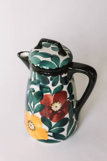 istock a white teapot  with floral and line pattern on white background 1127990487
