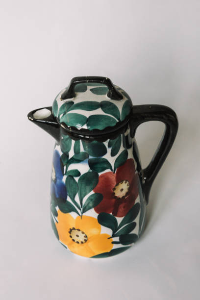 istock a white teapot  with floral and line pattern on white background 1127991248