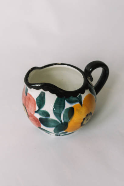 istock a white tea cup  with floral and line pattern on white background 1127991411