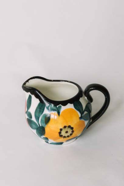 istock a white tea cup  with floral and line pattern on white background 1127991554