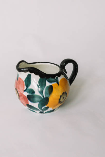 istock a white tea cup  with floral and line pattern on white background 1127991607