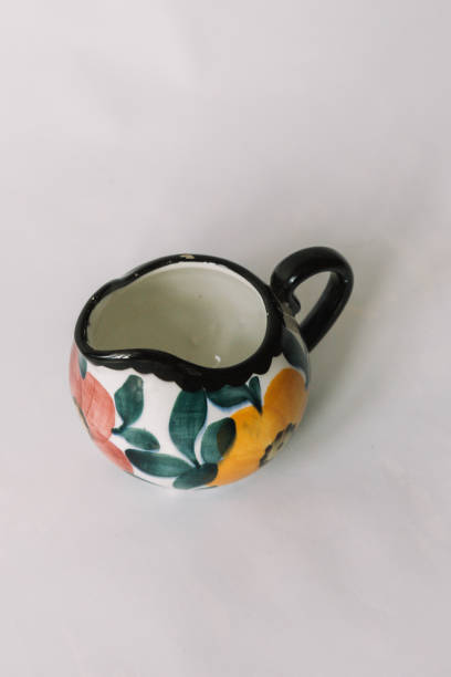 istock a white tea cup  with floral and line pattern on white background 1127991611