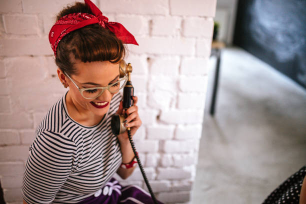 istock Pin Up Girl Using Telephone 1127992294