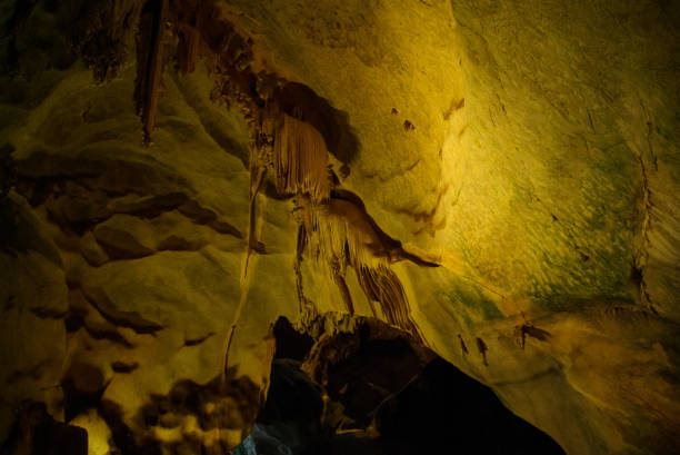 istock Karst cave, stalactites and stalagmites in a cave 1127992304