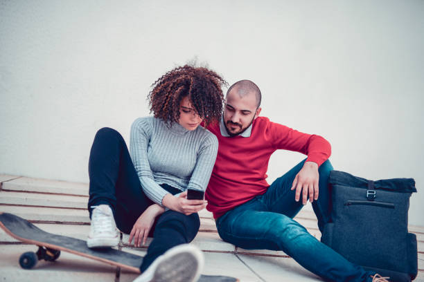 istock Young Urban Couple Making a Video Call With Smartphone 1127993241
