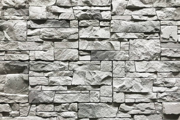 istock Stone wall with a grey color. Concept interior design background and texture 1127993674