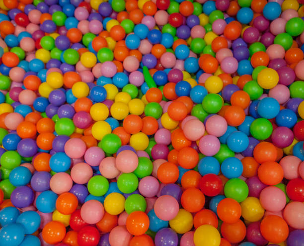 istock Colorful child balls. Multi-colored plastic balls. Achildren's playroom. Background texture of multi-colored plastic balls on playground 1127995138