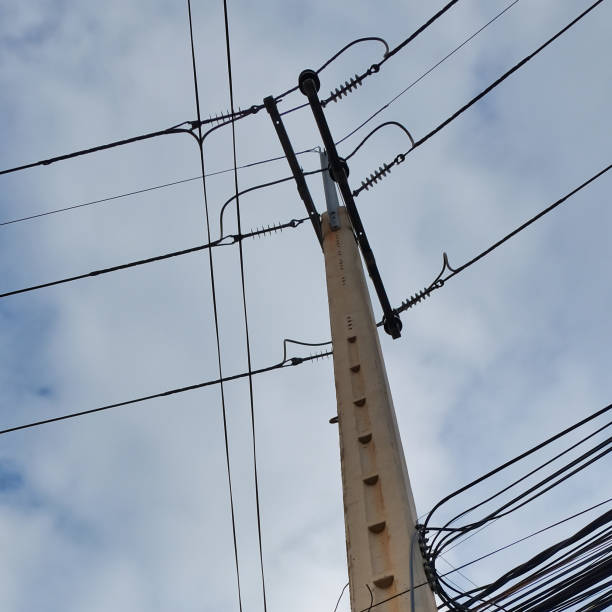 istock power line pylon, concrete pole and urban communications wires 1127995951