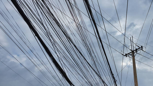 istock power line pylon, concrete pole and urban communications wires 1127995956