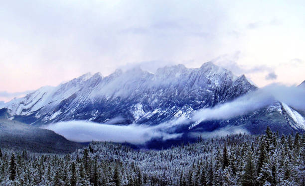 istock Clouds and a dusting of snow on mountains in Banff National Park 1127996221