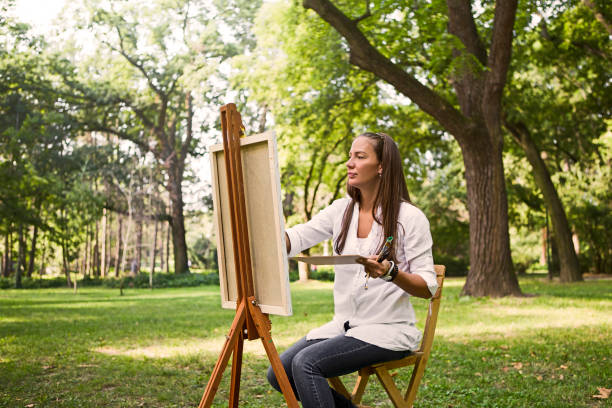 Artist paints beautiful landscape at the park