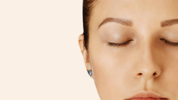 istock Female face with closed eyes, perfect skin, without make-up 1127997791