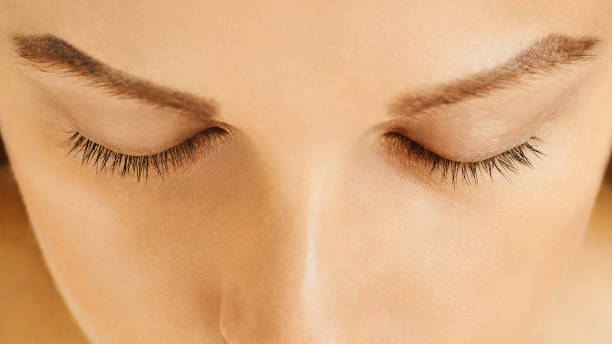 istock Female face with closed eyes, perfect skin, without make-up 1127997837