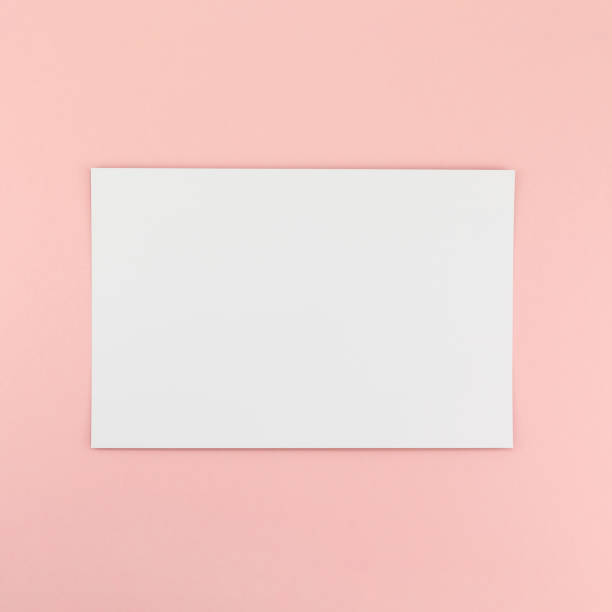 istock Blank A4 paper sheet mockup on pink background 1127999565