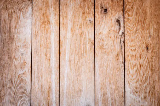 Old weathered brown wooden boards with beautiful grain as a background