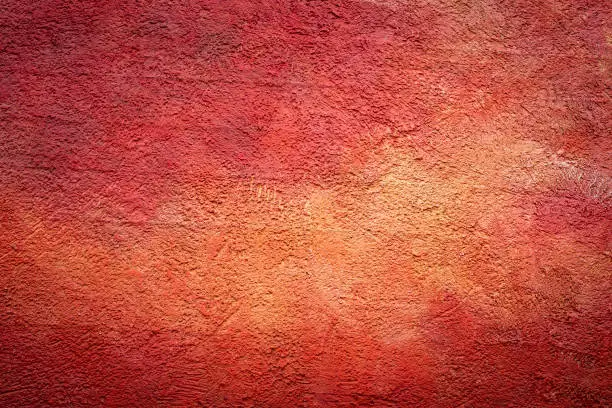 A red wall with a light vignette as a background
