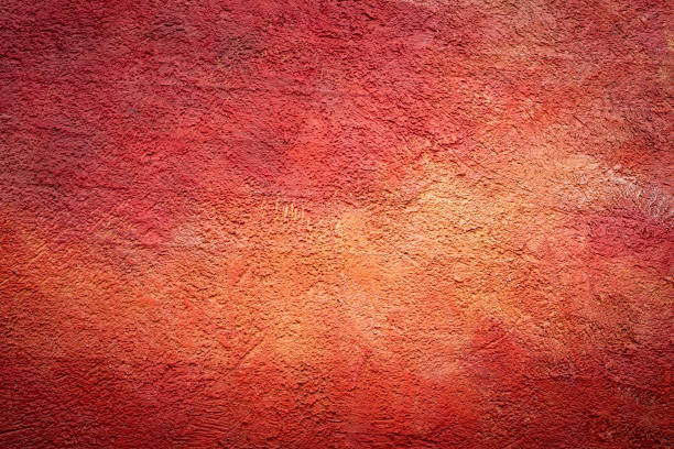 a red wall with a light vignette - konstruktion imagens e fotografias de stock