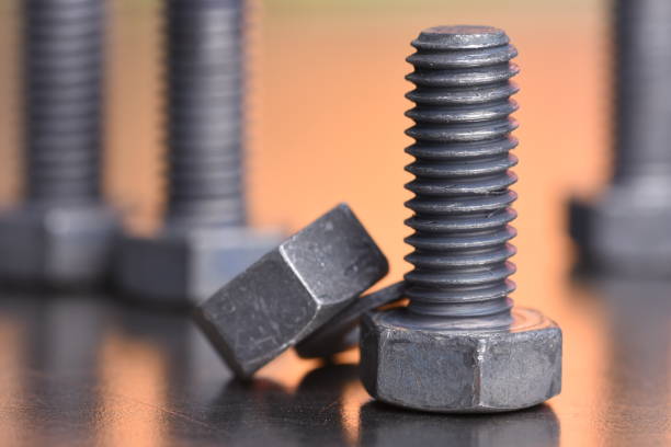 istock Steel bolt and nut with blurred background 1128000957