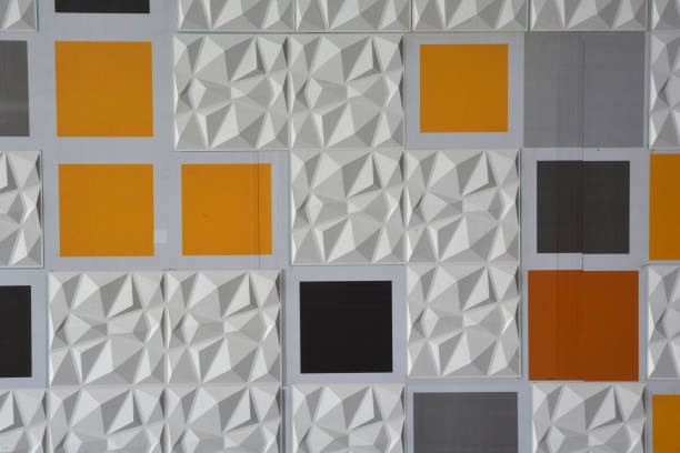 istock Abstract ceramic wall tiles in the shape of pyramid background. 1128001225