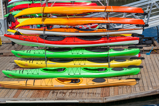 Victoria Bristish Colombia Canada Aug 26, 2017: Colorful rental kayaks waiting for customers to rent at the inner harbor.