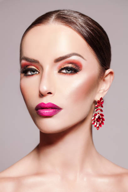 istock Beautiful Elegant And Confident Woman With Earring And Make-up 1128004373