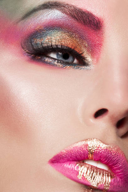 Artistic Colorful Make-up Liquid Gold On Lips stock photo