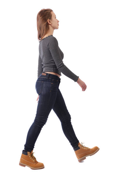 istock side view of walking woman. 1128010642