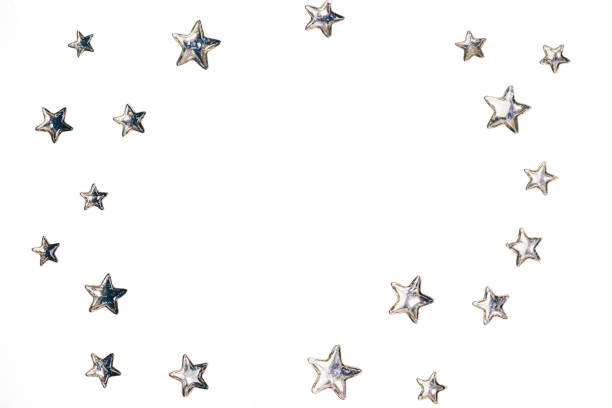 istock Shining silver stars arranged in circle on isolated white background. Copy space. Top view. 1128015512