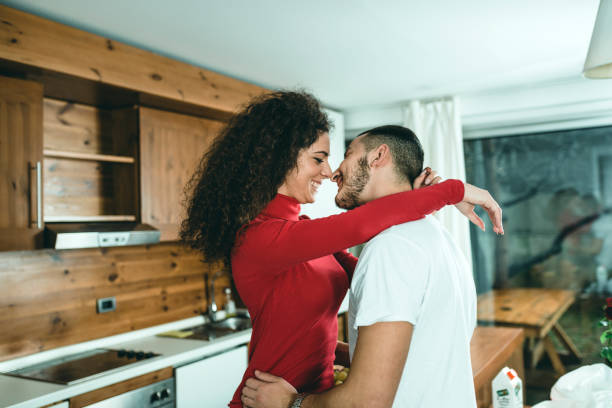 istock Romantic young couple cooking together in the kitchen,having a great time together. 1128015588