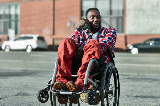 istock Happy disabled man talking on smart phone in city 1128016344