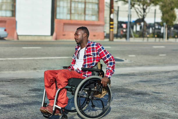 istock Thoughtful disabled man on wheelchair in city 1128016981