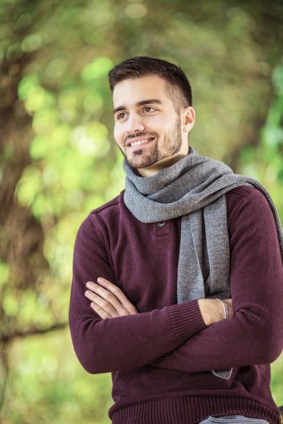 istock Beautiful young man posing in nature 1128017060