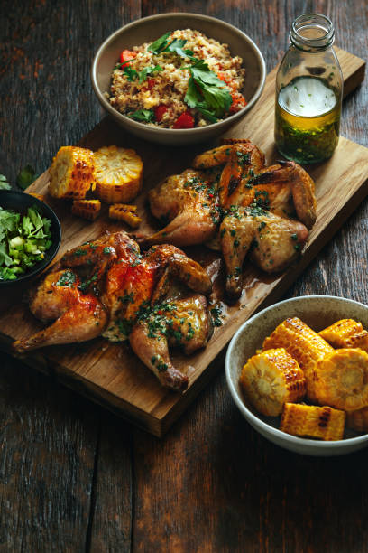 pollos enteros abiertos a la plancha - grilled chicken chicken corn salsa fotografías e imágenes de stock