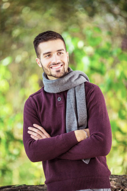 istock Beautiful young man posing outdoors 1128018091