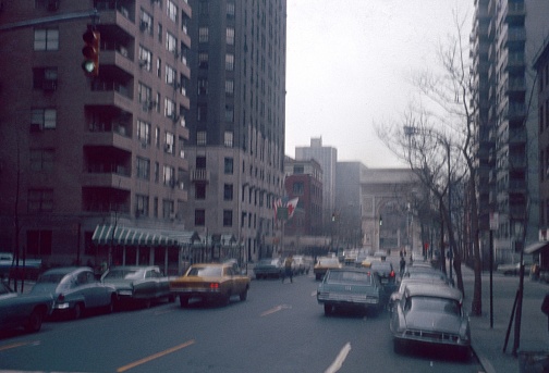 New York City, NY, USA, 1967. 5th Avenue near Washington Square. Also: triumphal arch, apartments, pedestrians and cars.