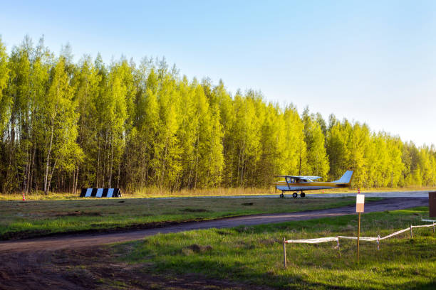 Light passenger planes parked before departure at private airport in Kronshtadt, St.Petersburg, Russia. Industrial and civil air transportation by aircraft. Professional flights on airplanes
