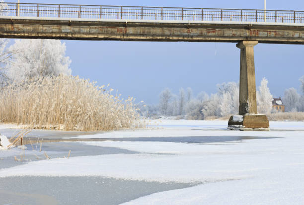 istock Winter landscape of a frozen river. 1128019351