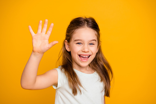 Girl enjoys the sun with arms outstretched and having fun