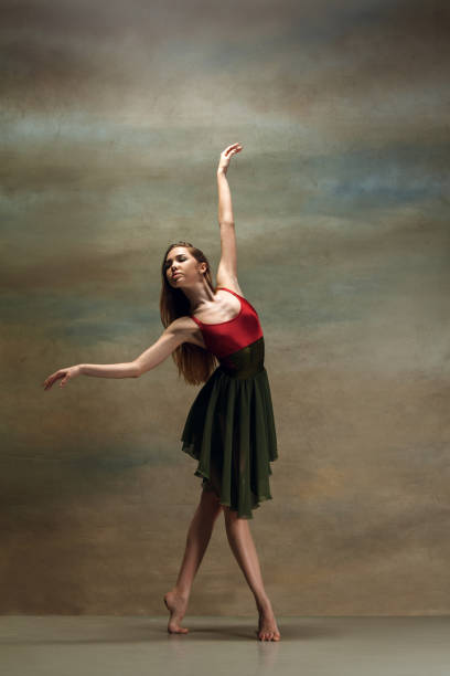 istock The woman dancing on gray 1128023189