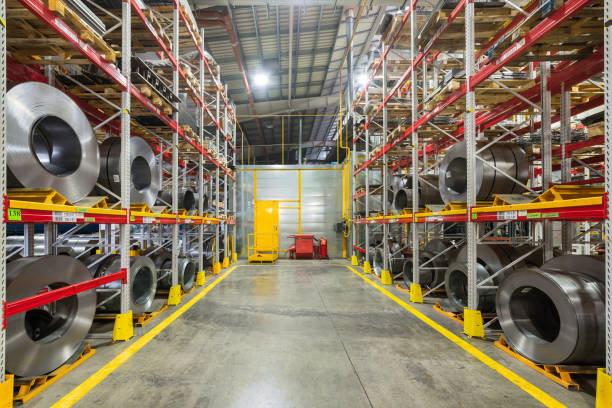 istock Tiered rack with sheet metal rolls. Internal warehouse of raw materials 1128023628