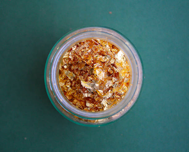 istock Golden leaves in a glass jar 1128024001