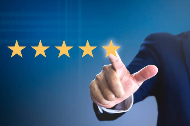 Rating with five stars for a satisfaction and enjoyment Hand of a man giving high score with five golden stars rating for movie or television programme or anything that having the required qualities. Show the feeling of a satisfaction and enjoyment. "r admired stock pictures, royalty-free photos & images