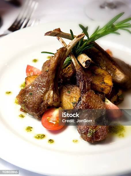 Lambchop Dinner On A White Plate Stock Photo - Download Image Now - Lamb Chop, Animal Bone, Color Image