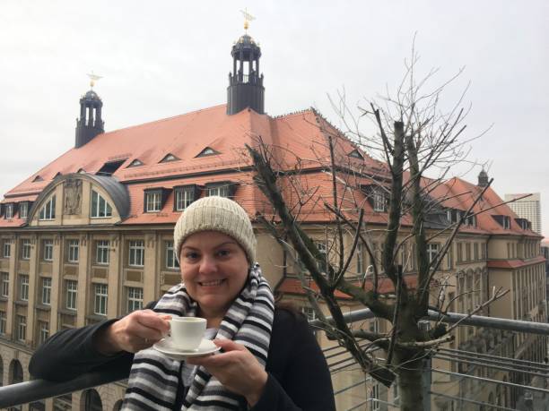 istock Lady poses drinking coffee at the barciny during winter time 1128029038