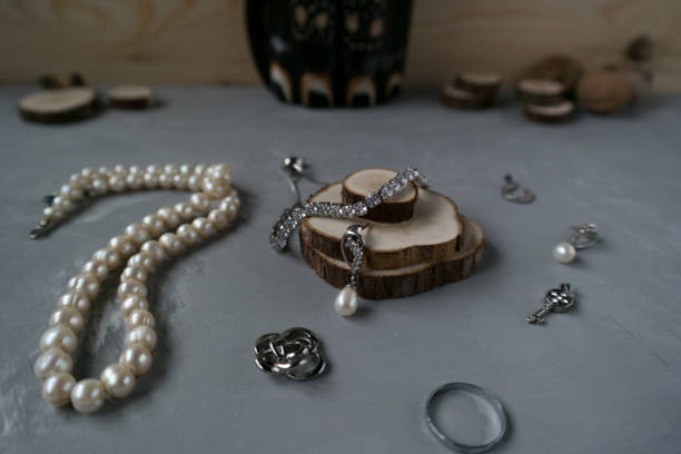 istock Thread of pearls with silver jewelry 1128029230