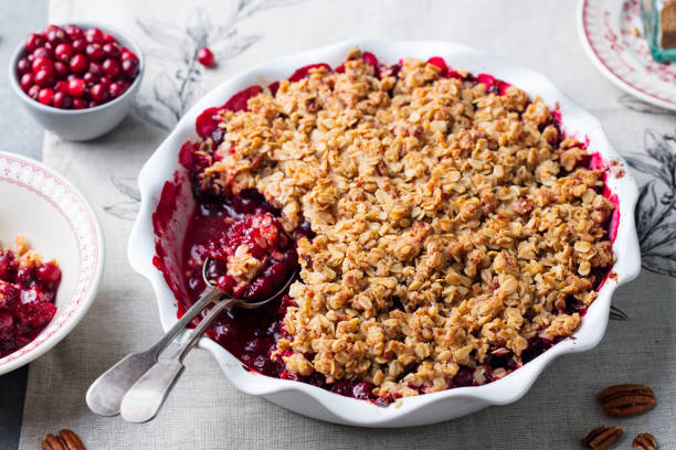 Cranberry crumble, crisp in a baking dish. Grey background. Close up. stock photo