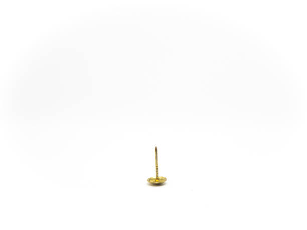 istock gold metal thumb tack on isolated white background 1128030010