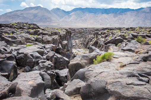 Fossil Falls formed years ago when the Owens River carved through the volcanic basalt rocks in the Eastern Sierra Nevada of California